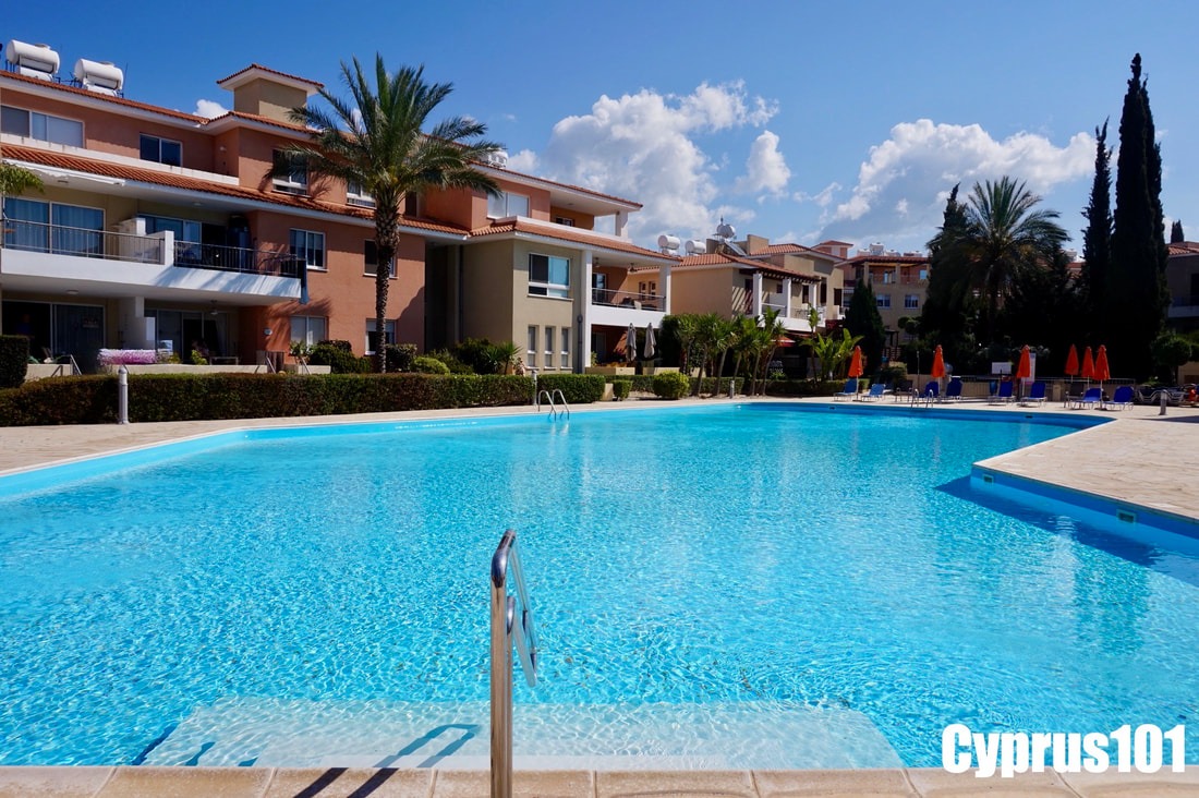 Apartment Complex with beautiful landscaping and communal pool